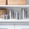 imageOggi Set of 4 Stainless Steel Kitchen Canisters  Airtight Clamp Lid Clear SeeThru Top  Ideal for Kitchen Storage Food Storage Pantry Storage  Includes 1 each 26oz 36oz 47oz 62oz4pc New