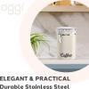 imageOggi Stainless Steel Coffee Canister 62 fl oz  Airtight Clamp Lid Clear SeeThru Top  Ideal for Coffee Bean Storage Ground Coffee Storage Kitchen Storage Pantry Storage Large Size 5quot x 75quotWarm Gray