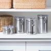 imageOggi Stainless Steel Coffee Canister 62 fl oz  Airtight Clamp Lid Clear SeeThru Top  Ideal for Coffee Bean Storage Ground Coffee Storage Kitchen Storage Pantry Storage Large Size 5quot x 75quotStainless Steel