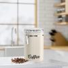 imageOggi Stainless Steel Coffee Canister 62 fl oz  Airtight Clamp Lid Clear SeeThru Top  Ideal for Coffee Bean Storage Ground Coffee Storage Kitchen Storage Pantry Storage Large Size 5quot x 75quotWarm Gray